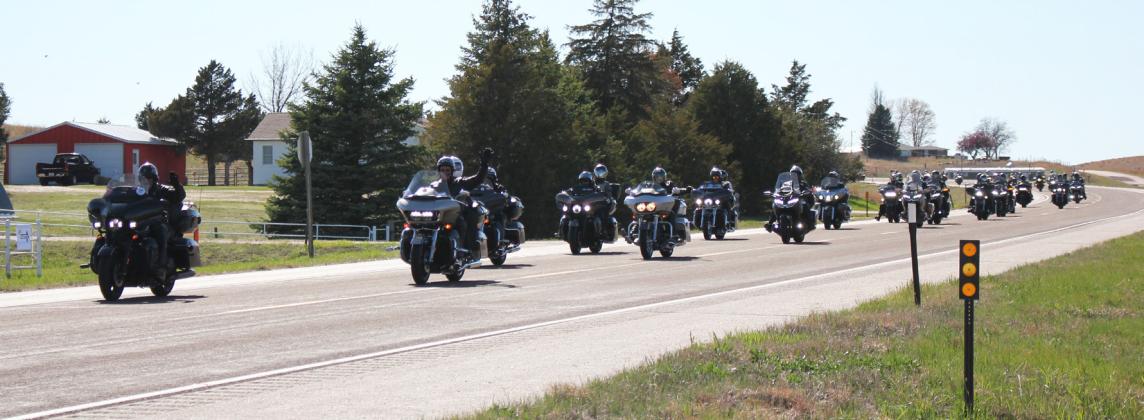 The Kyle Petty Charity Ride Across America makes their way into Mullen on Highway 2.